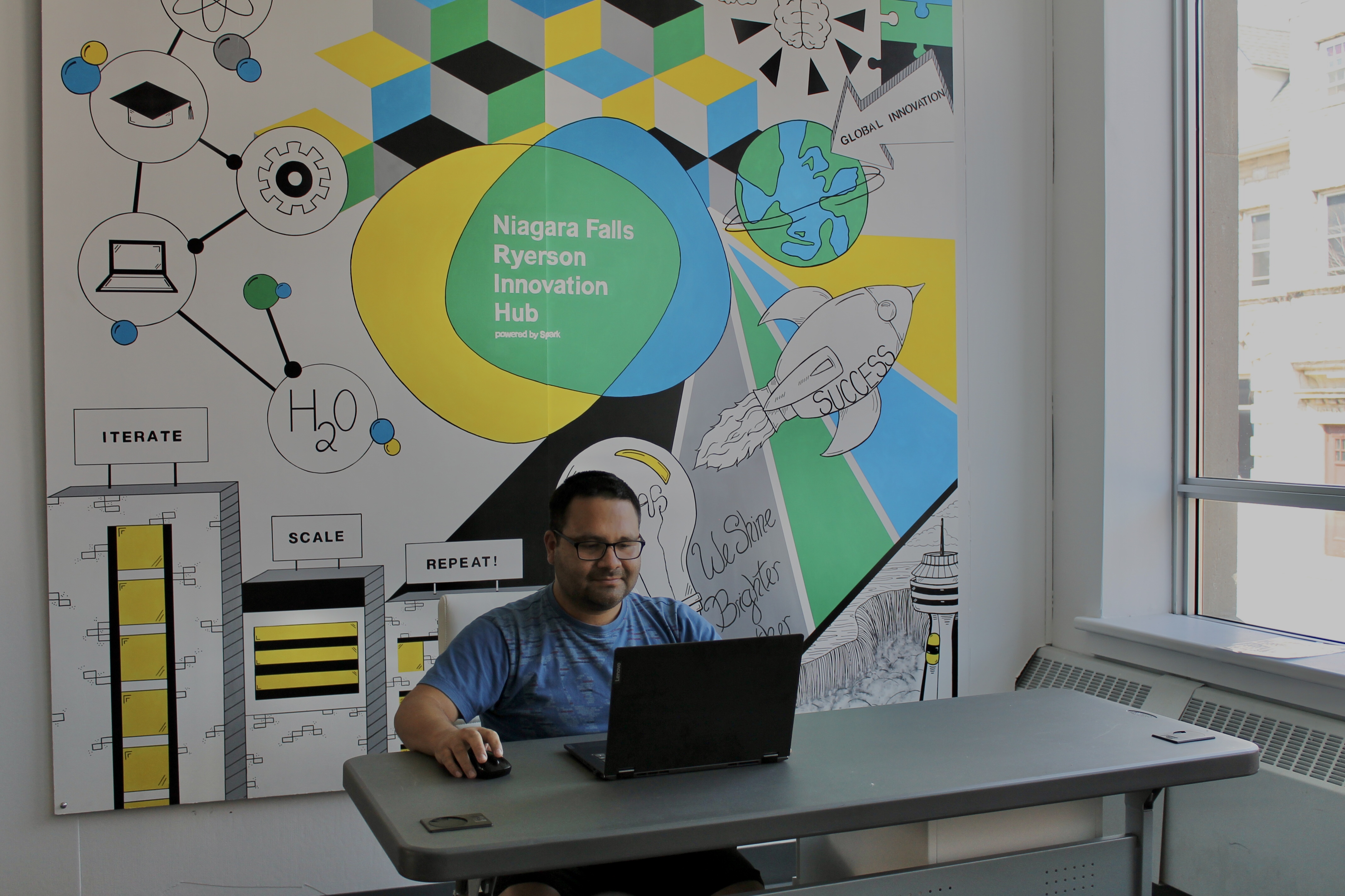 Two founders reading computer